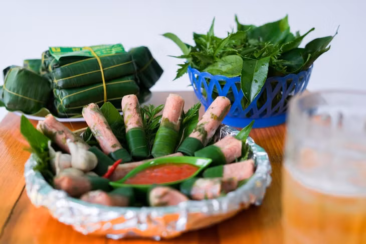 越南北中南三地的酸肉卷风味 ảnh 2