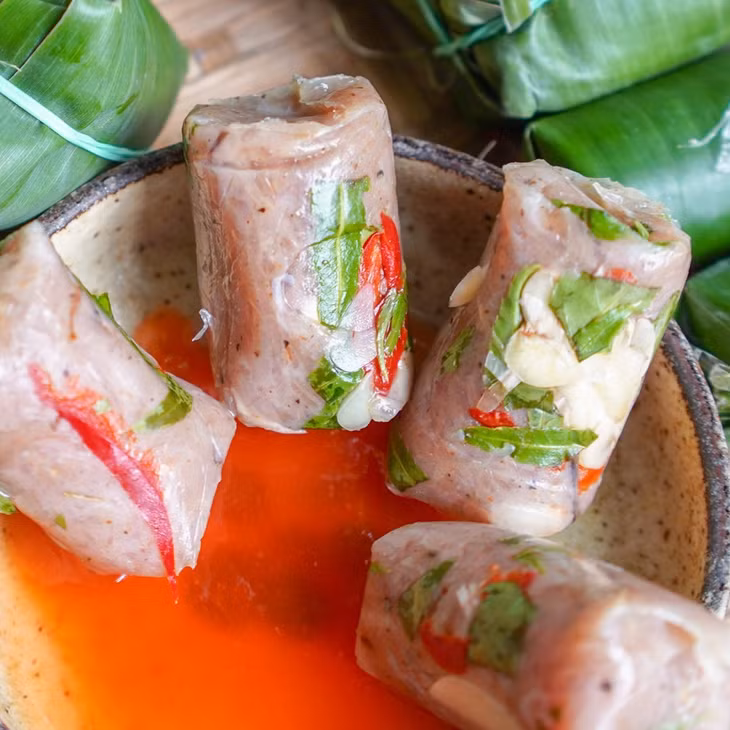 越南北中南三地的酸肉卷风味 ảnh 4